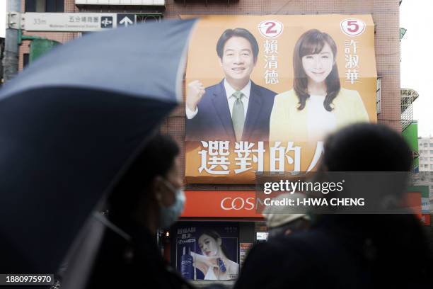 An election campaign billboard showing Taiwan's ruling Democratic Progressive Party presidential candidate Lai Ching-te and legislative candidate Hsu...