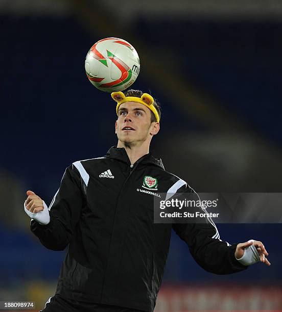 Wales player Gareth Bale in action wearing a set of Pudsey ears as part of the BBC Children In Need Charity campaign, during the Wales press...