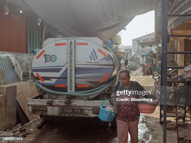 Water truck supplies freshwater in Penjaringan, North Jakarta, Indonesia, on Friday, Aug. 4, 2023. One in three Jakartans does not have access to...