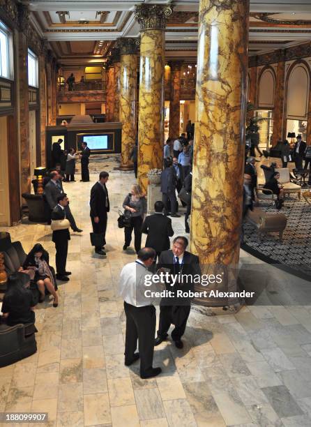 Guests mingle in the lobby of the historic Fairmont Hotel in San Francisco's upscale Nob Hill district. The luxury hotel, which opened in 1907, is...