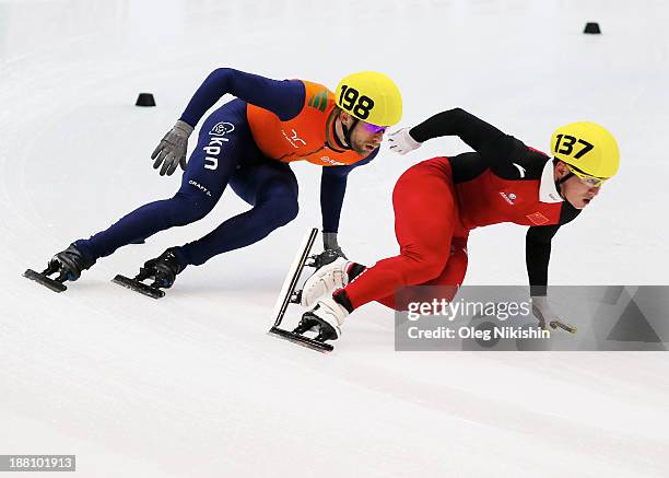 Wenhao Liang of China and Daan Breeuwsma of Netherlands compete during the Men's 5000m Relay Heats during day two of the Samsung ISU Short Track...