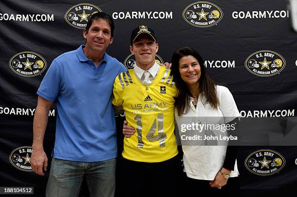 Valor Christian High School football player standout Christian McCaffrey stands with his dad Ed McCaffrey and mom Lisa McCaffrey during his U.S....