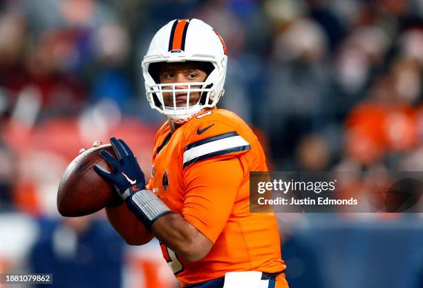 Quarterback Russell Wilson of the Denver Broncos passes during the 1st quarter of the game against the New England Patriots at Empower Field At Mile...