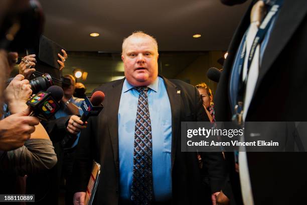 Toronto Mayor Rob Ford is swarmed by media at City Hall after City Council striped him of emergency management powers on November 15, 2013 in...