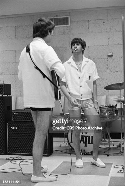 The Beatles rehearsing at the Deauville Hotel, Miami Beach, Florida for THE ED SULLIVAN SHOW. George Harrison and Ringo Starr take a break. Image...
