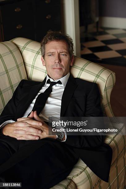 Actor Hugh Laurie is photographed for Madame Figaro on October 3, 2013 in London, England. Suit and shirt , tie , personal watch. CREDIT MUST READ:...