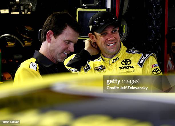 Matt Kenseth, driver of the Dollar General Toyota, talks with crew chief Jason Ratcliff during practice for the NASCAR Sprint Cup Series Ford...