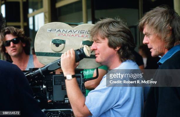 British director Alan Parker lines up a shot in a camera viewfinder on the set of his movie 'Mississippi Burning', Braxton, Mississippi, May 6, 1988.