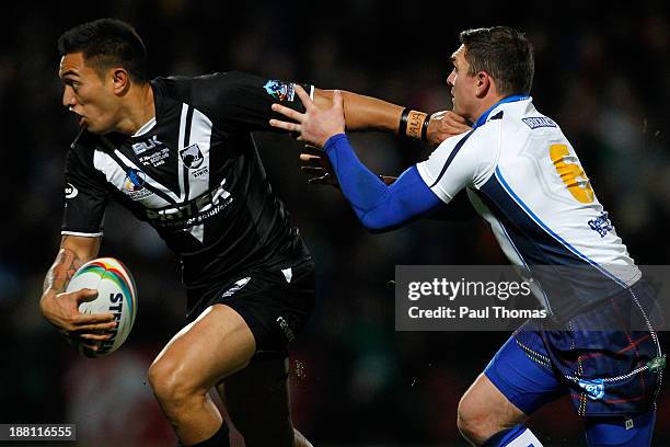 Dean Whare of New Zealand in action with Danny Brough of Scotland during the Rugby League World Cup Quarter Final match between New Zealand and...