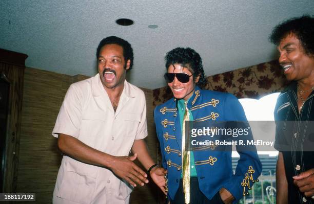 In a hotel room during the 1984 Democratic National Convention, American pop singer Michael Jackson , along with his father Joe , attend a press...