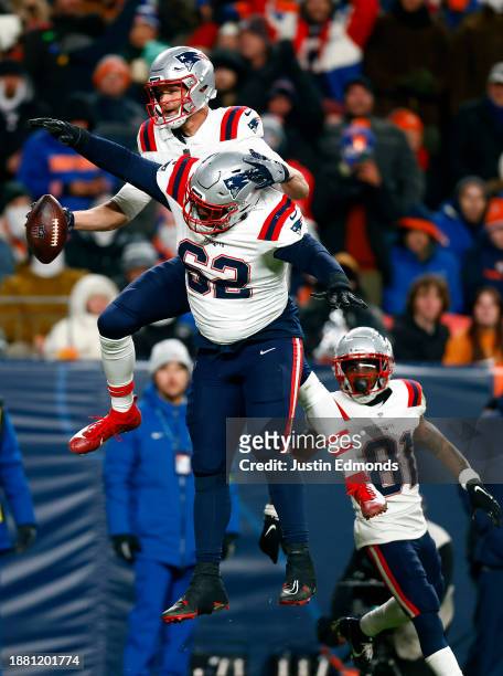 Tight end Mike Gesicki of the New England Patriots celebrates a touchdown catch with guard Sidy Sow during the 3rd quarter of the game against the...