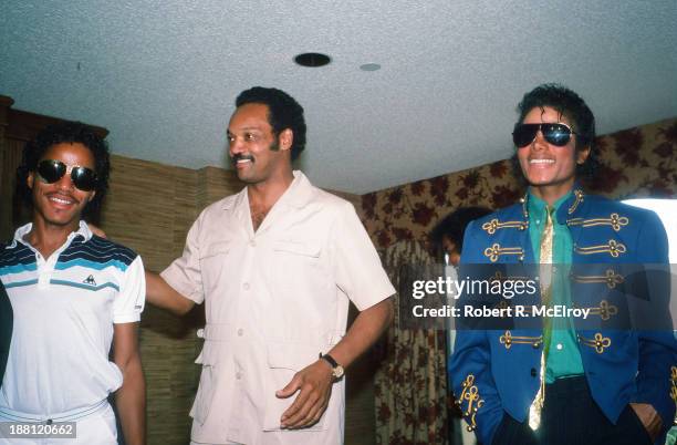 In a hotel room during the 1984 Democratic National Convention, American sibling pop singers Marlon and Michael Jackson attend a press conference...