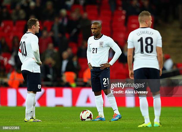 Jermain Defoe and Wayne Rooney of England kick off after Chile's second goal during the international friendly match between England and Chile at...