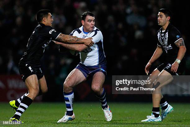 Kane Linnett of Scotland is tackled by Dean Whare of New Zealand during the Rugby League World Cup Quarter Final match at Headingley Stadium on...