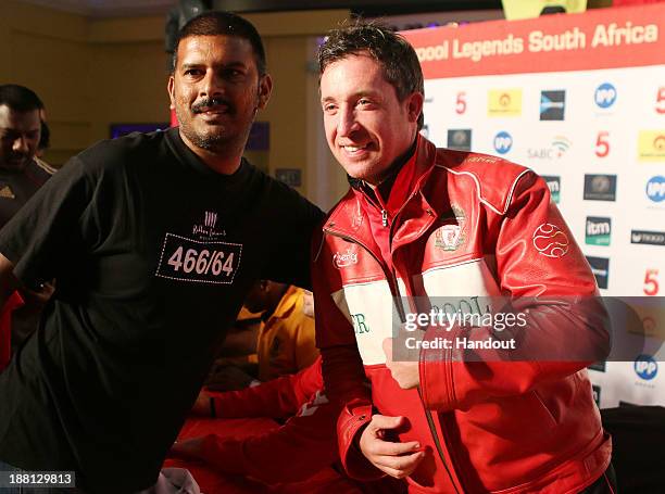 In this handout image provided by the ITM Group, Robbie Fowler attends the Liverpool FC Legends and Kaizer Chiefs Legends autograph session at...