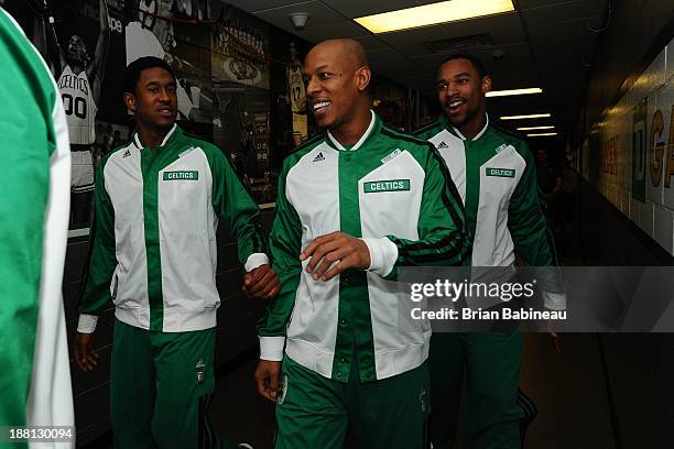 Marshon Brooks, Keith Bogans and Jared Sullinger of the Boston Celtics walk to the court for warm ups prior to the game against the Portland...
