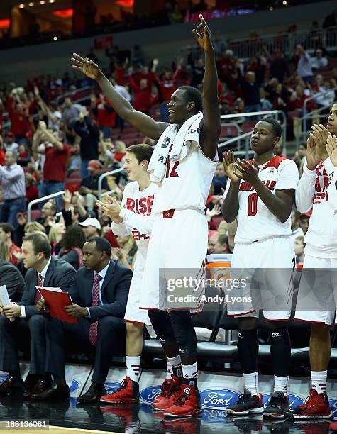 Mangok Mathiang of the Louisville Cardinals celebrates during the game against the Cornell Big Red at KFC YUM! Center on November 15, 2013 in...