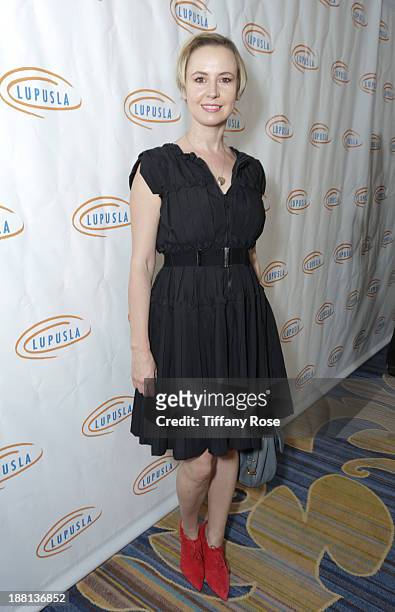 Actress Caroline Carver attends the Hollywood Bag Ladies Luncheon on November 15, 2013 in Beverly Hills, California.