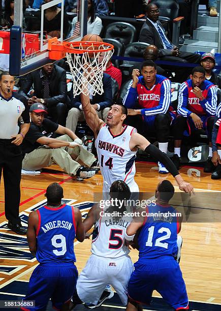 Gustavo Ayon of the Atlanta Hawks shoots against the Philadelphia 76ers on November 15, 2013 at Philips Arena in Atlanta, Georgia. NOTE TO USER: User...