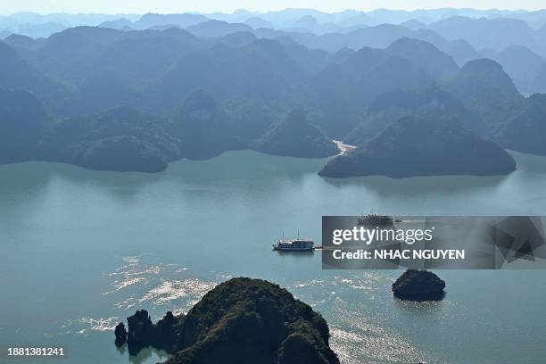 This aerial photo taken from a seaplane shows tourist boats sailing on the waters of Ha Long Bay in Vietnam's northeastern province of Quang Ninh on...