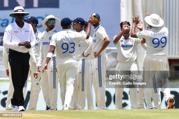 Indian players celebrate the dismisssal of Dean Elgar of South Africa for 185 runs during day 3 of the 1st test match between South Africa and India...