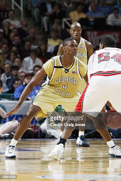 Chris Bosh of Georgia Tech guards Marcus Melvin of North Carolina State during the quarter final game of the ACC Tournament on March 14, 2003 at the...