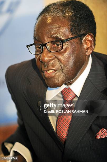 Zimbabwes President Robert Mugabe talks to the media after attending his 24-year-old first-born child and only daughter Bona Mugabe's convocation at...
