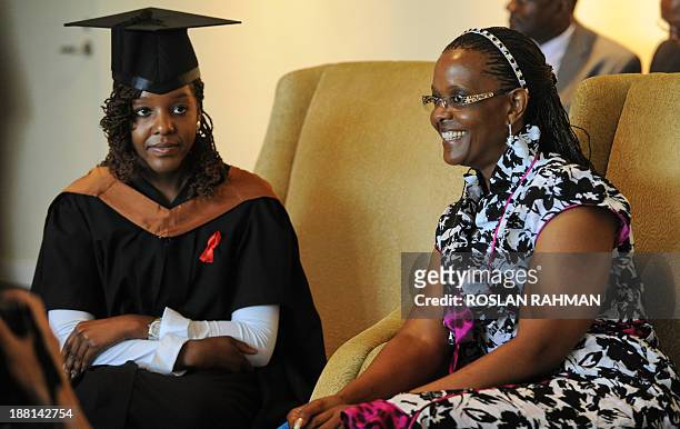 Zimbabwes President Robert Mugabe's wife Grace with her 24-year-old first-born child and only daughter Bona Mugabe after the convocation at...