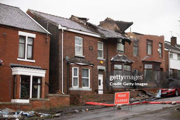 Roofs can be seen ripped off homes on Hough Hill Road following a tornado on December 28, 2023 in Stalybridge, England. Houses in the Tameside area...