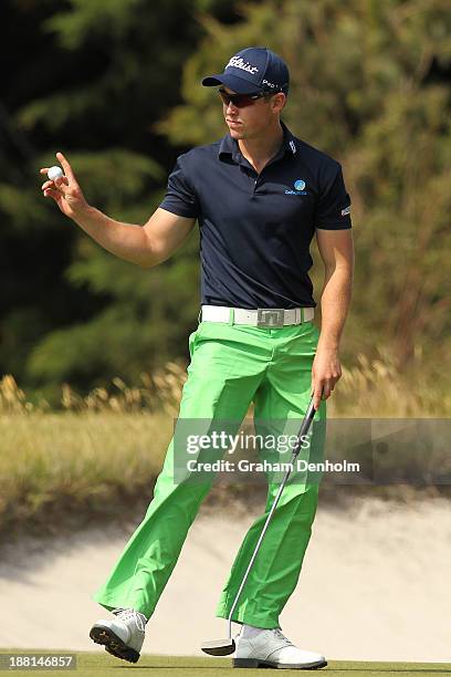 Nathan Holman of Australia waves to the crowd during round three of the 2013 Australian Masters at Royal Melbourne Golf Course on November 16, 2013...