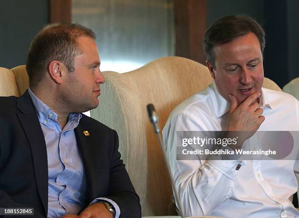 United Kingdom Prime Minister David Cameron talks with Malta Prime Minister Dr. Joseph Muscat during a working session of the Commonwealth Heads of...