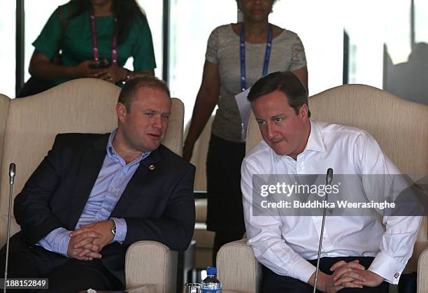 United Kingdom Prime Minister David Cameron talks with Malta Prime Minister Dr. Joseph Muscat during a working session of the Commonwealth Heads of...