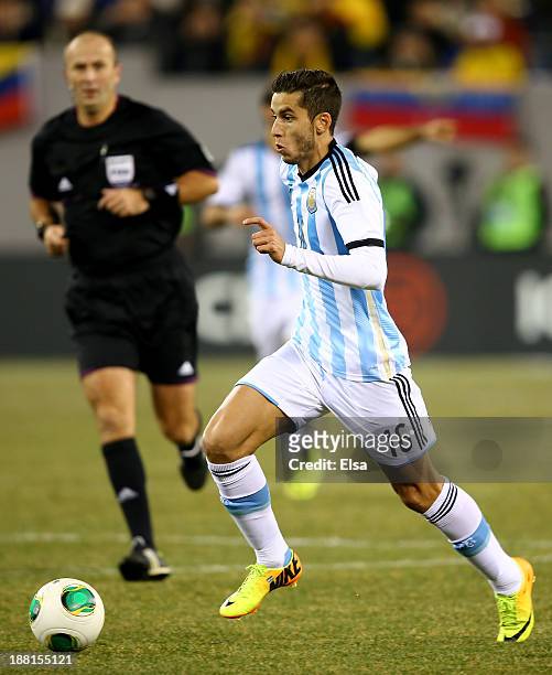 Ricardo Alvarez of Argentina takes the ball in the first half against Ecuador during a friendly match at MetLife Stadium on November 15, 2013 in East...