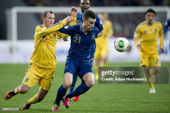 Laurent Koscielny of France fights for the ball with Ukraine's Roman