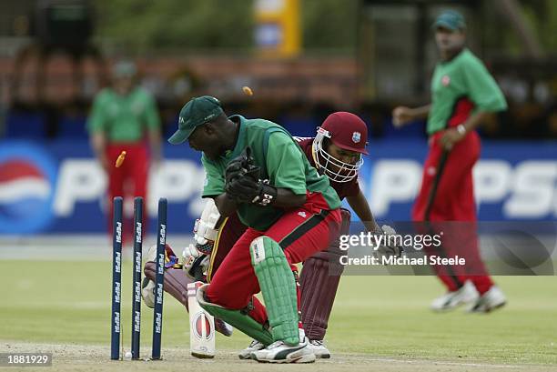 Kennedy Obuya of Kenya attempts to run out Shivnarine Chanderpaul of the West Indies during the ICC Cricket World Cup Group B game between Kenya and...