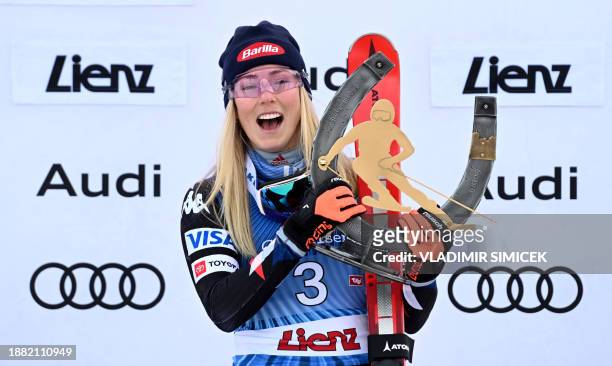 Winner US' Mikaela Shiffrin poses on the podium after the Women's Giant Slalom race at the FIS Alpine Skiing World Cup event on December 28, 2023 in...