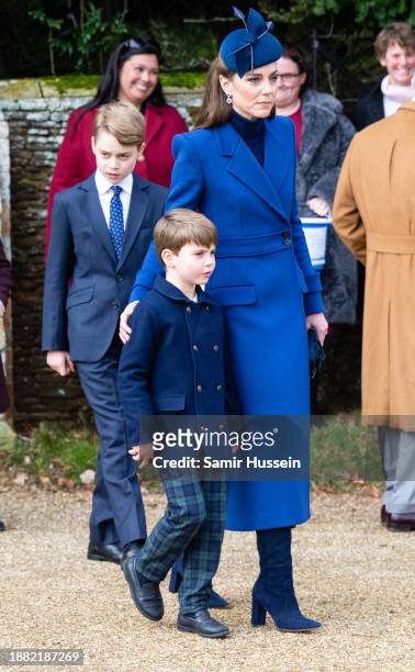 Prince George of Wales, Prince Louis of Wales and Catherine, Princess of Wales attend the Christmas Morning Service at Sandringham Church on December...