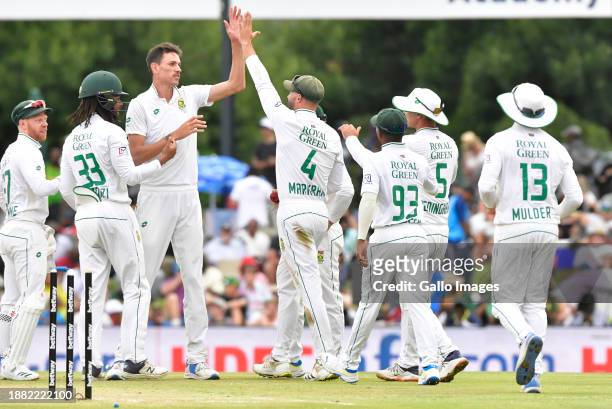 Marco Jansen of South Africa celebrates his dismissal of Shreyas Iyer of India with his teammates during day 3 of the 1st test match between South...
