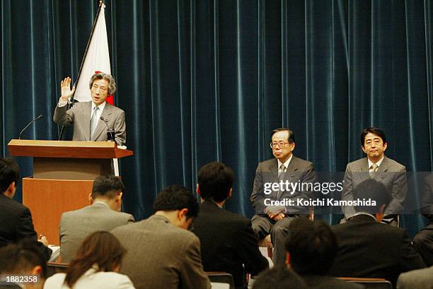 Japanese Prime Minister Junichiro Koizumi speaks during a media conference while Chief Cabinet Secretary Yasuo Fukuda , and Deputy Chief Cabinet...