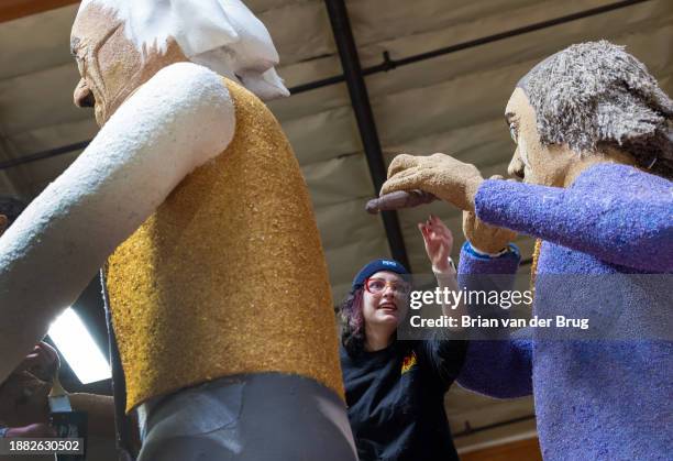 Irwindale, CA Volunteer Allison Grainger decorates Elks U.S.A. "Chimes of Liberty/Protecting Our Future" Rose Parade float at Phoenix Decorating...