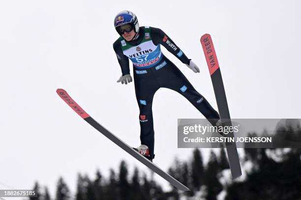 Germany's Andreas Wellinger soars through the air during his first jump during a training session in preparation of the first stage of the Four-Hills...