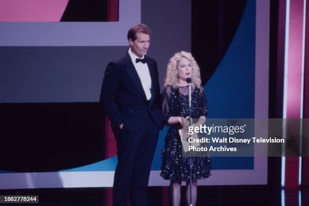 Ed O'Neill, Julia Duffy presenting at the 1990 Emmy Awards / 42th Annual Emmy Awards, at the Pasadena Civic Auditorium.