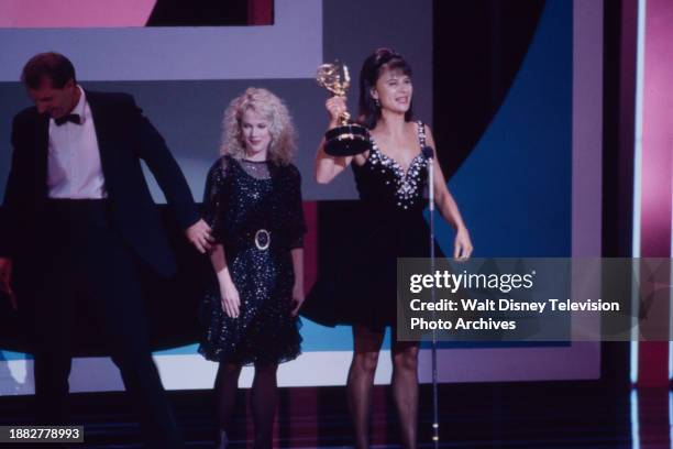 Ed O'Neill, Julia Duffy, Tracey Ullman accepting her Emmy award, appearing on the 1990 Emmy Awards / 42th Annual Emmy Awards, at the Pasadena Civic...