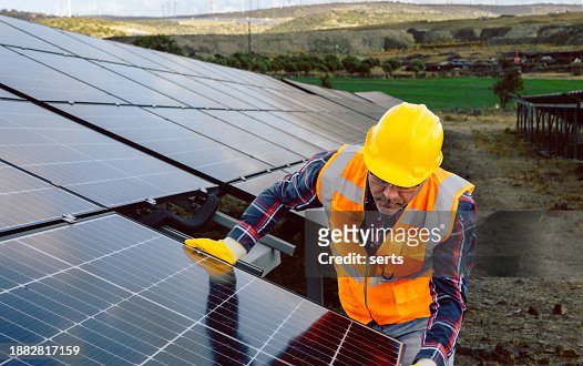 Renewable Energy Revolution: Worker Installing Solar Panel Replacement