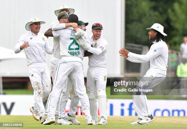 Kagiso Rabada runs Jasprit Bumrah of India out and celebrates with teammates during day 3 of the 1st test match between South Africa and India at...