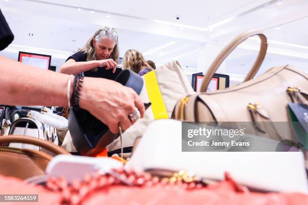 Shoppers looks through the bargain bins at the David Jones flagship store in Elizabeth Street during the Boxing Dy Sale on December 26, 2023 in...