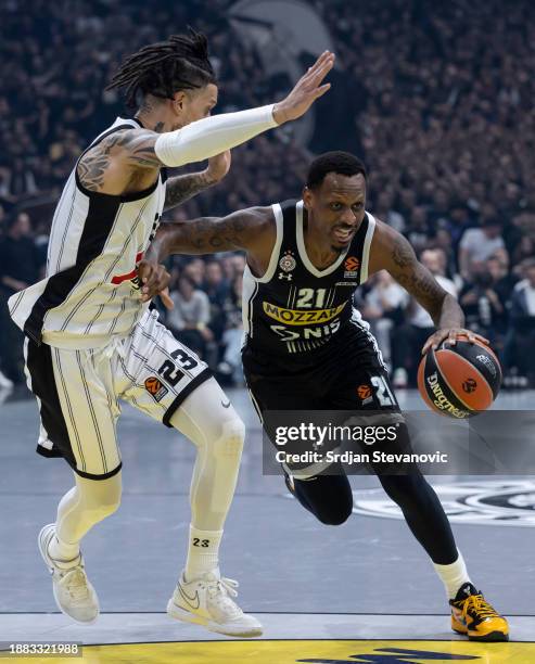 James Nunnally, #21 of Partizan Mozzart Bet Belgrade in action against Daniel Hackett, #23 of Virtus Segafredo Bologna during the Turkish Airlines...