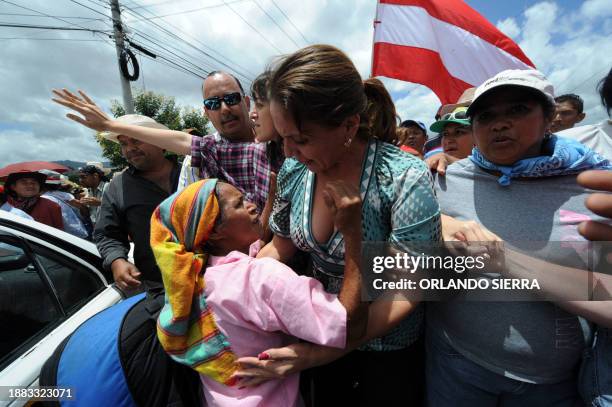 The wife of Honduran ousted President Manuel Zelaya, Xiomara Castro de Zelaya , joins supporters of her husband protesting in Tegucigalpa on July 18,...