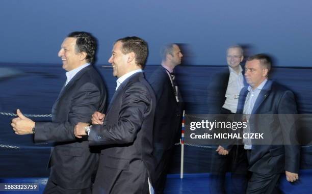 Commission chief Jose Manuel Barroso and Russian President Dmitry Medvedev disembark from a boat trip on the Amur river as they attend a Russia-EU...