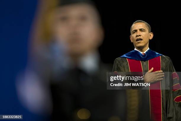 President Barack Obama sings the National Anthem during the Arizona State University commencement ceremony at Sun Devil Stadium in Tempe, Arizona May...